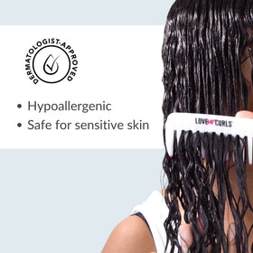Love Ur Curls pouring conditioner on hand to show detangling slip