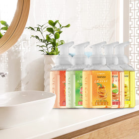 Lovery bottle beside common items to show size and scale for countertop fit