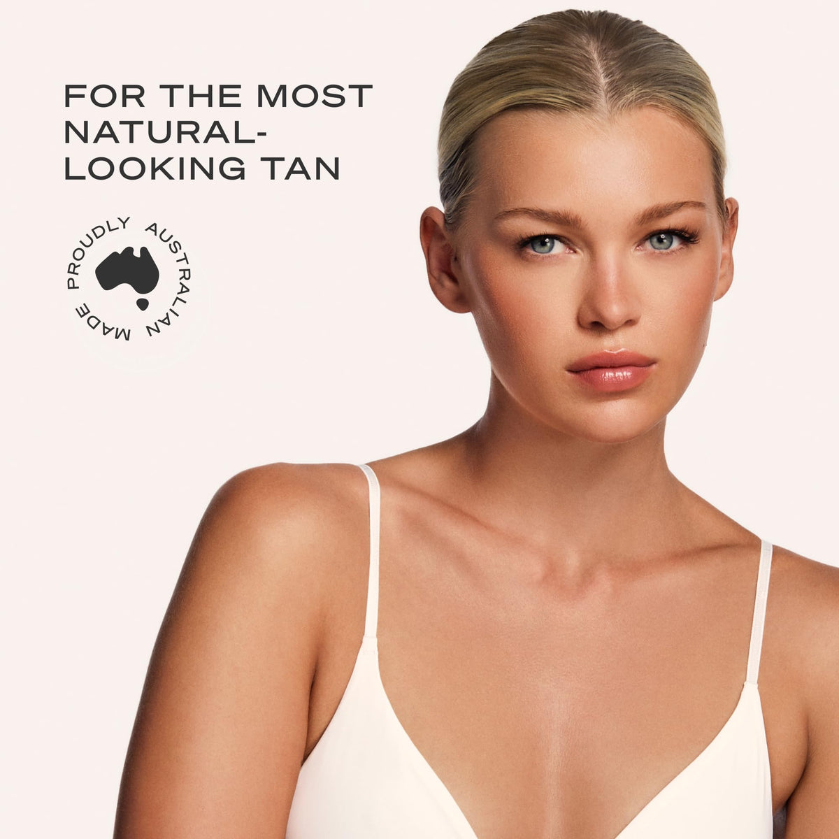 Loving Tan close-up applying mousse to arm for smooth blend
