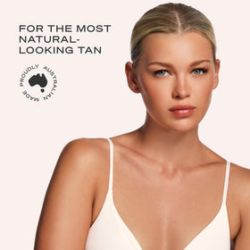 Loving Tan close-up applying mousse to arm for smooth blend