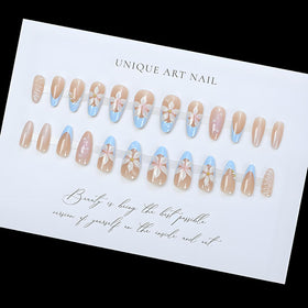 LPOODDNU nails held in hand for scale showing medium almond length benefit