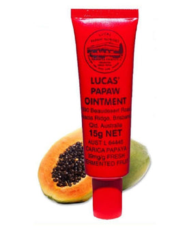 Lucas Papaw tube in travel flatlay with passport showing TSA-friendly convenience benefit