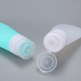 LUFEVRM filled bottles next to passport to show travel-friendly size