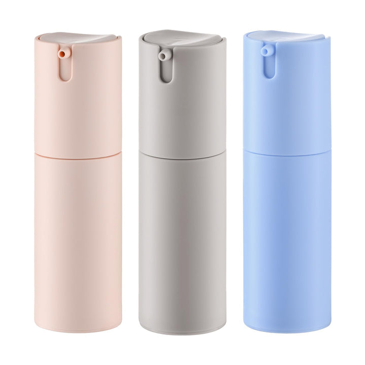 Lulupack front view of three 1 oz airless pump bottles showing colors and caps, travel convenience