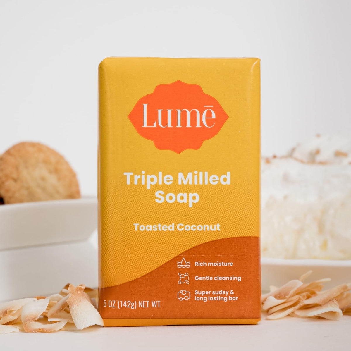 Lume bar on bathroom shelf styled with coconut accents for warm scent