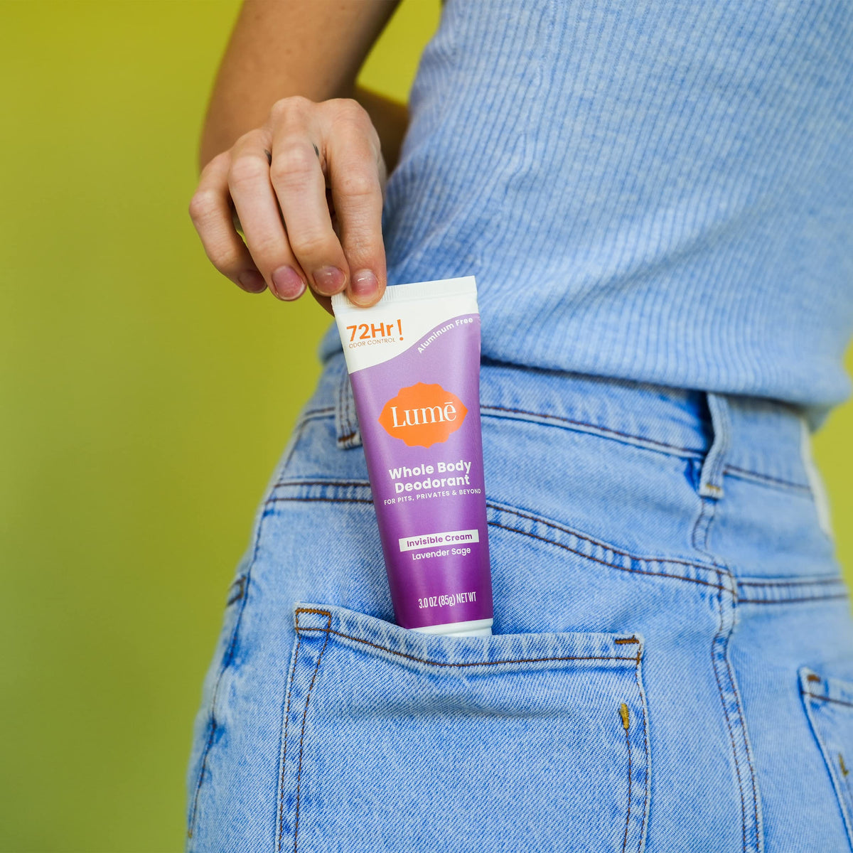 Applying Lume underarm demonstrating odor control for everyday confidence