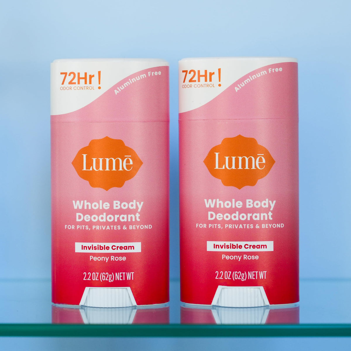 Lume on bathroom counter with peony accent conveying light floral scent