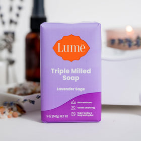Lume bar on bathroom shelf styled to convey calm, spa-like experience