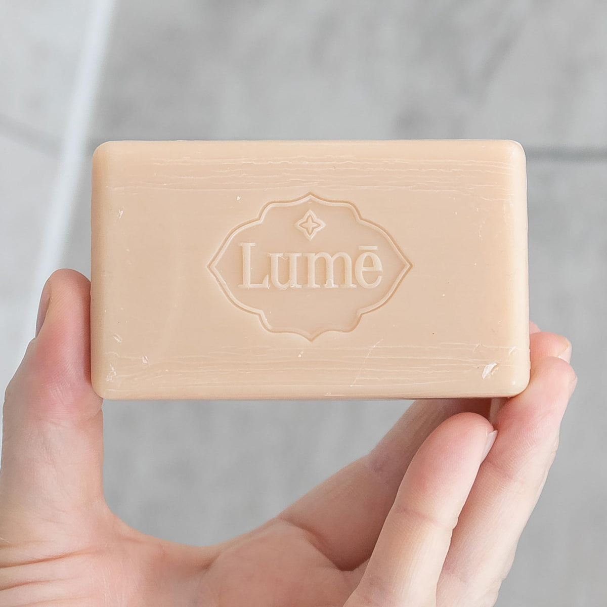 Lume bar in bathroom lifestyle scene suggesting daily moisturizing use