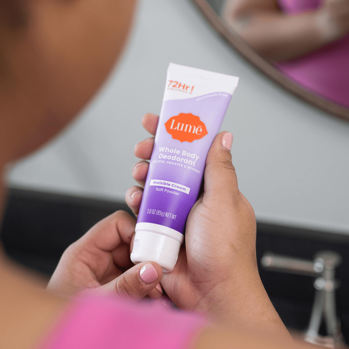 Lume 3.0 ounce tube held in hand to show compact travel-friendly benefit