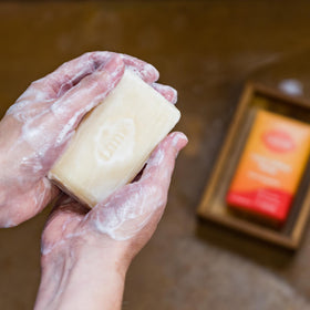 Lume soap styled with tangerine fruit showing bright citrus scent benefit