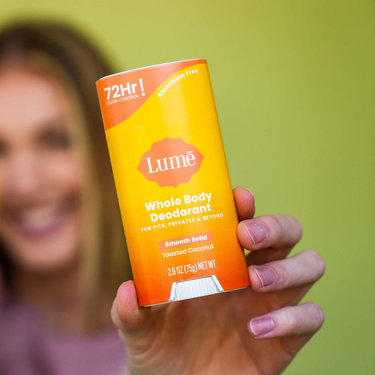 Lume stick used on foot demonstrating whole-body odor control and fresh feeling