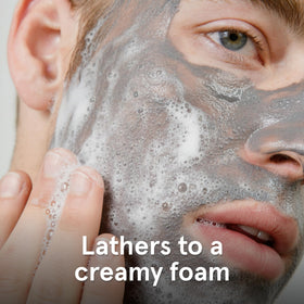 Lumin charcoal cleanser texture close-up highlighting gentle exfoliation