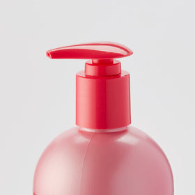 Luster's pink oil moisturizer pouring texture close-up showing smooth slip benefit