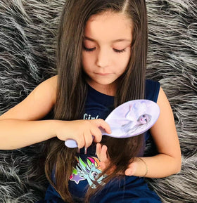 LUV HER close-up of cushioned brush pad showing gentle detangling action