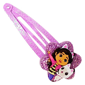 LUV HER clips beside a hairbrush in a lifestyle shot showing everyday usability