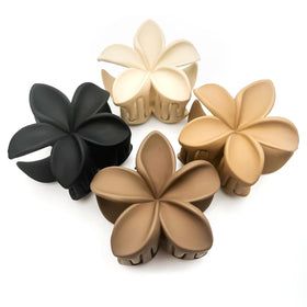 Luvearo front view of four plumeria flower clips showing design and colors