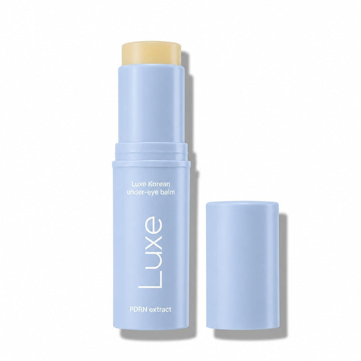 LUXE under eye balm front packaging showing compact stick and branding, convenient