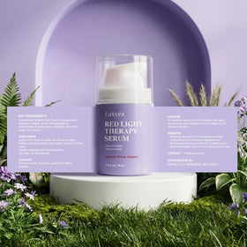 Luxvez bottle beside green tea leaves indicating antioxidant-rich botanical support