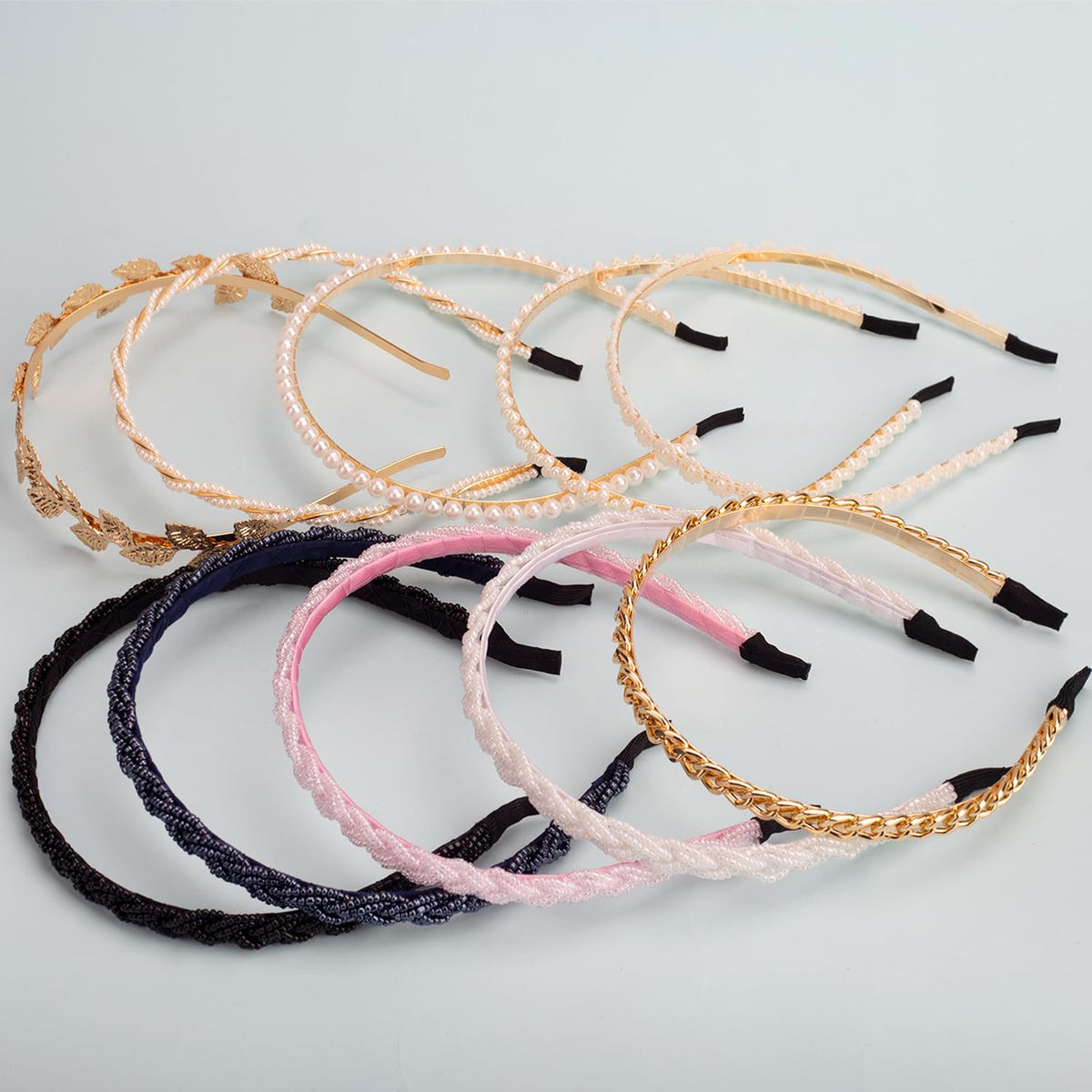 LYroo headbands held in hand showing slim design and portable scale