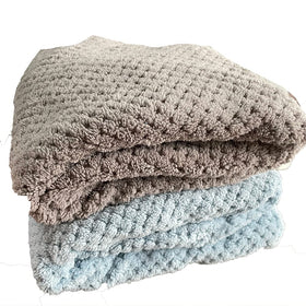 M-bestl two folded towels ready to wash highlighting easy care