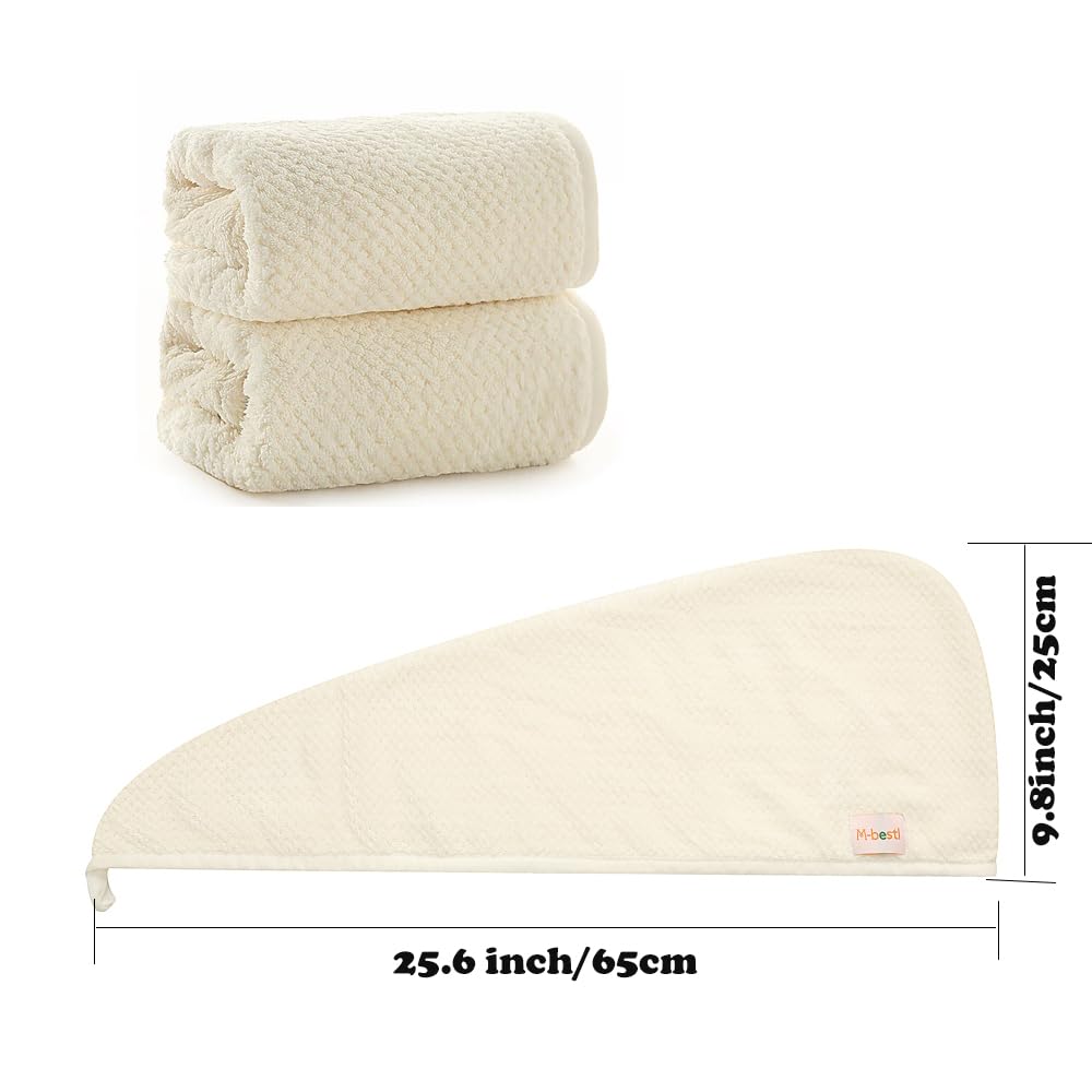 M-bestl towel beside a hand showing size and coverage for most head lengths