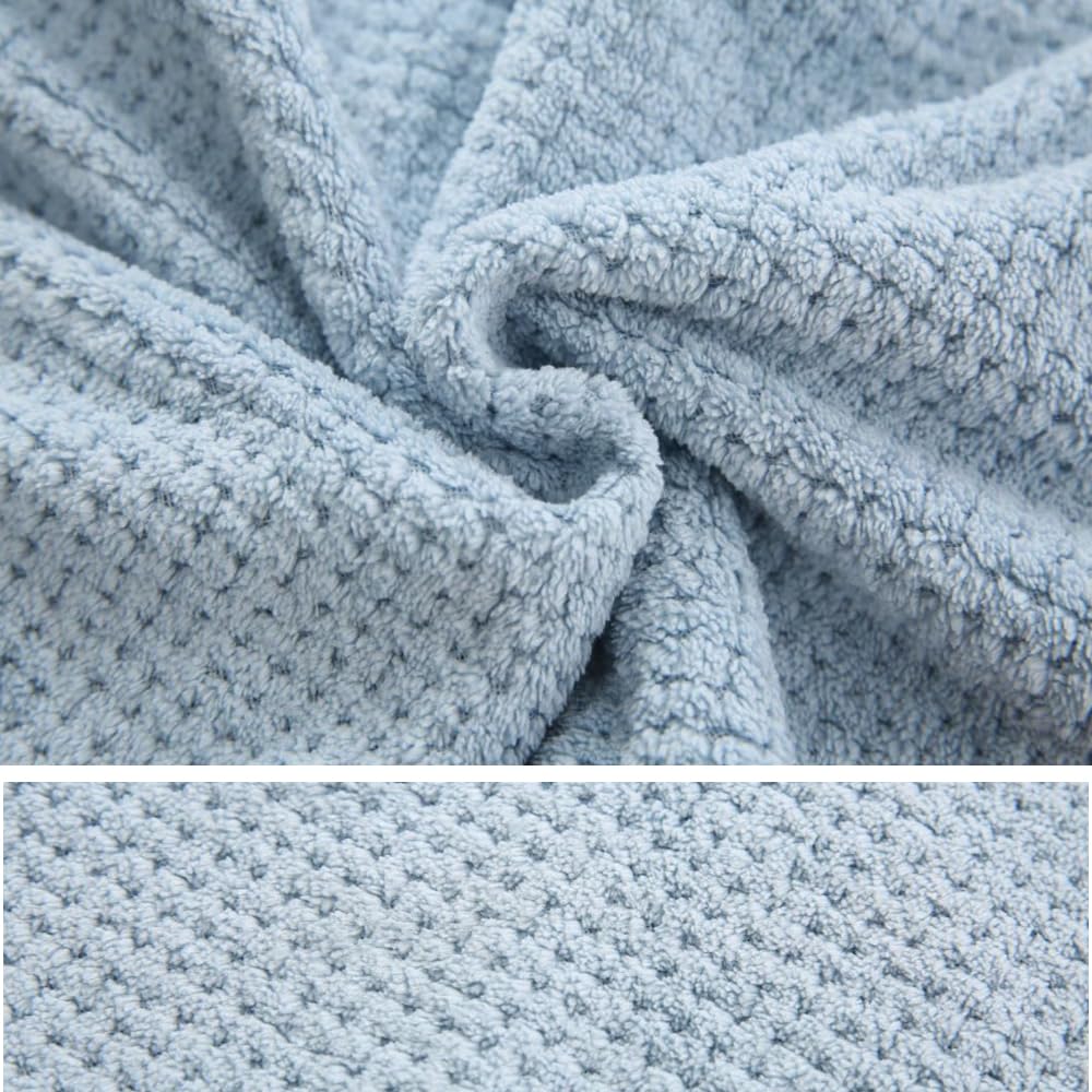 M-bestl towel draped over hand showing length and coverage advantage