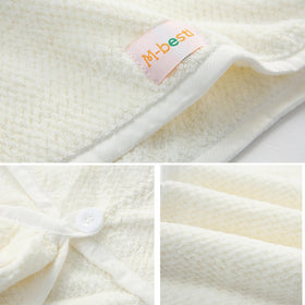 M-bestl woman wearing towel wrap after shower demonstrating convenient use