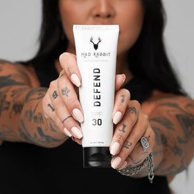 Mad Rabbit being applied to a hand demonstrating non-greasy coverage and comfort