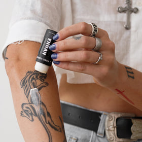 Mad Rabbit balm stick displayed in aftercare kit highlighting on-the-go convenience