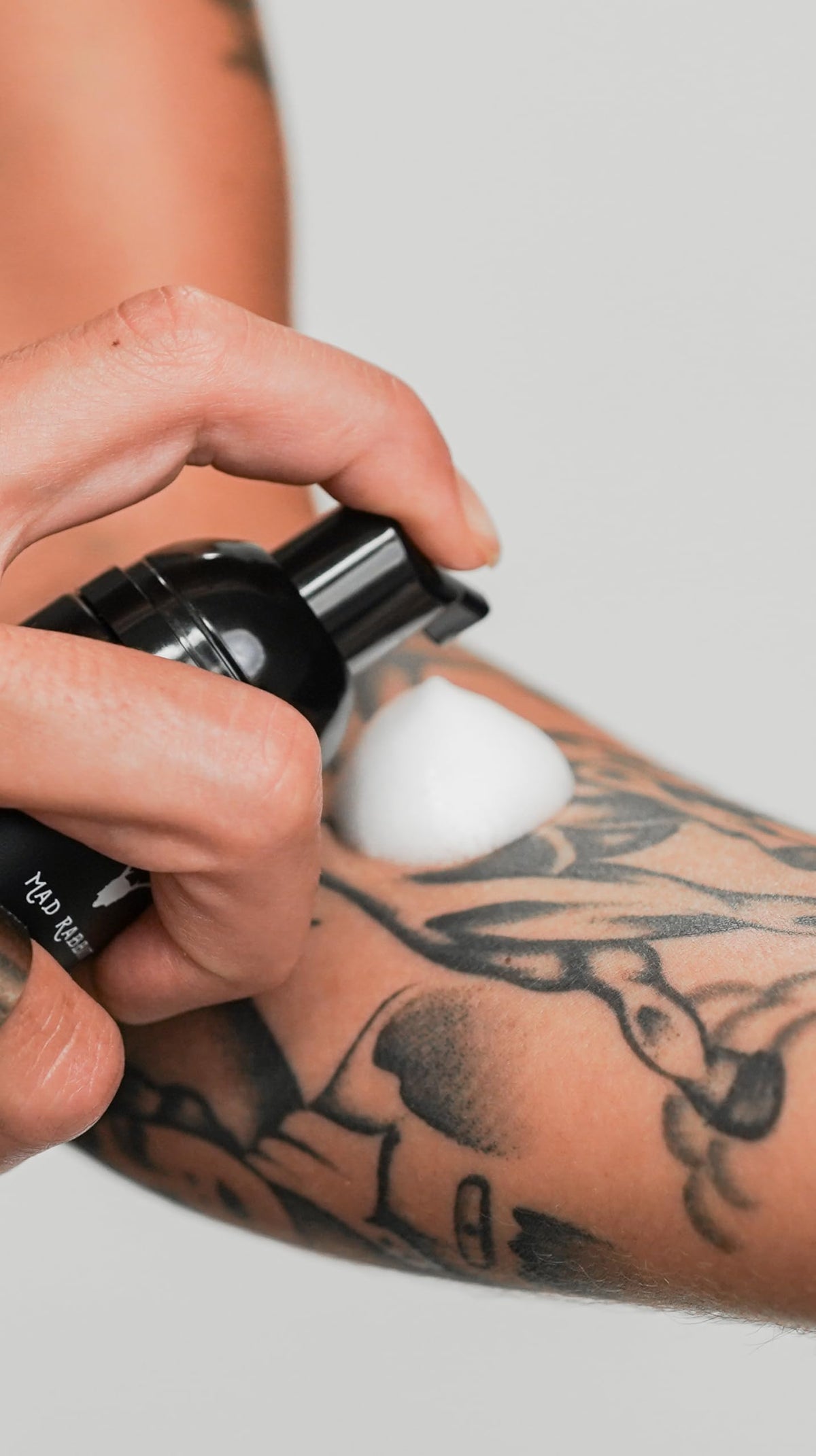 Mad Rabbit bottle staged in bathroom for everyday aftercare routine