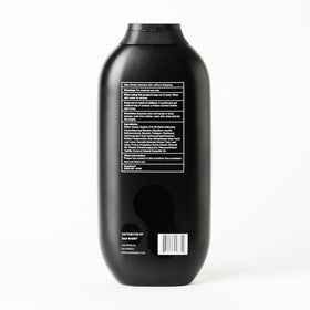 Mad Rabbit bottle styled on bathroom shelf, suggests everyday skincare routine