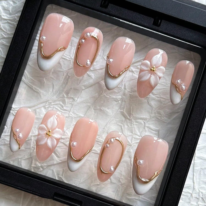 MAGLFELL front view of almond press-on nails showing floral design and salon finish