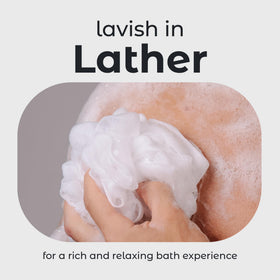 MainBasics loofah in hand for scale and comfortable grip demonstration
