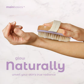 MainBasics brush used in shower demonstrating gentle wet exfoliation benefit
