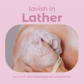 MainBasics loofah held in hand showing compact size and ergonomic grip