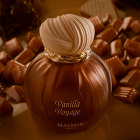 MAISON ASRAR bottle next to hand for scale showing 100ml size and true proportions benefit