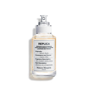 Maison Margiela front bottle view showing compact refillable design and portability