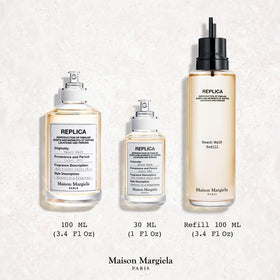 Maison Margiela 1 oz bottle next to keys showing travel-ready size and convenience