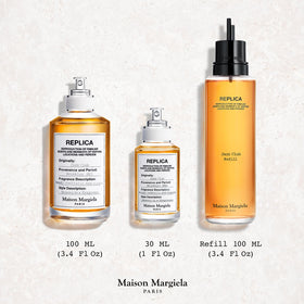 Maison Margiela Jazz Club next to pen for scale to show compact 1.0 fl oz travel-friendly size