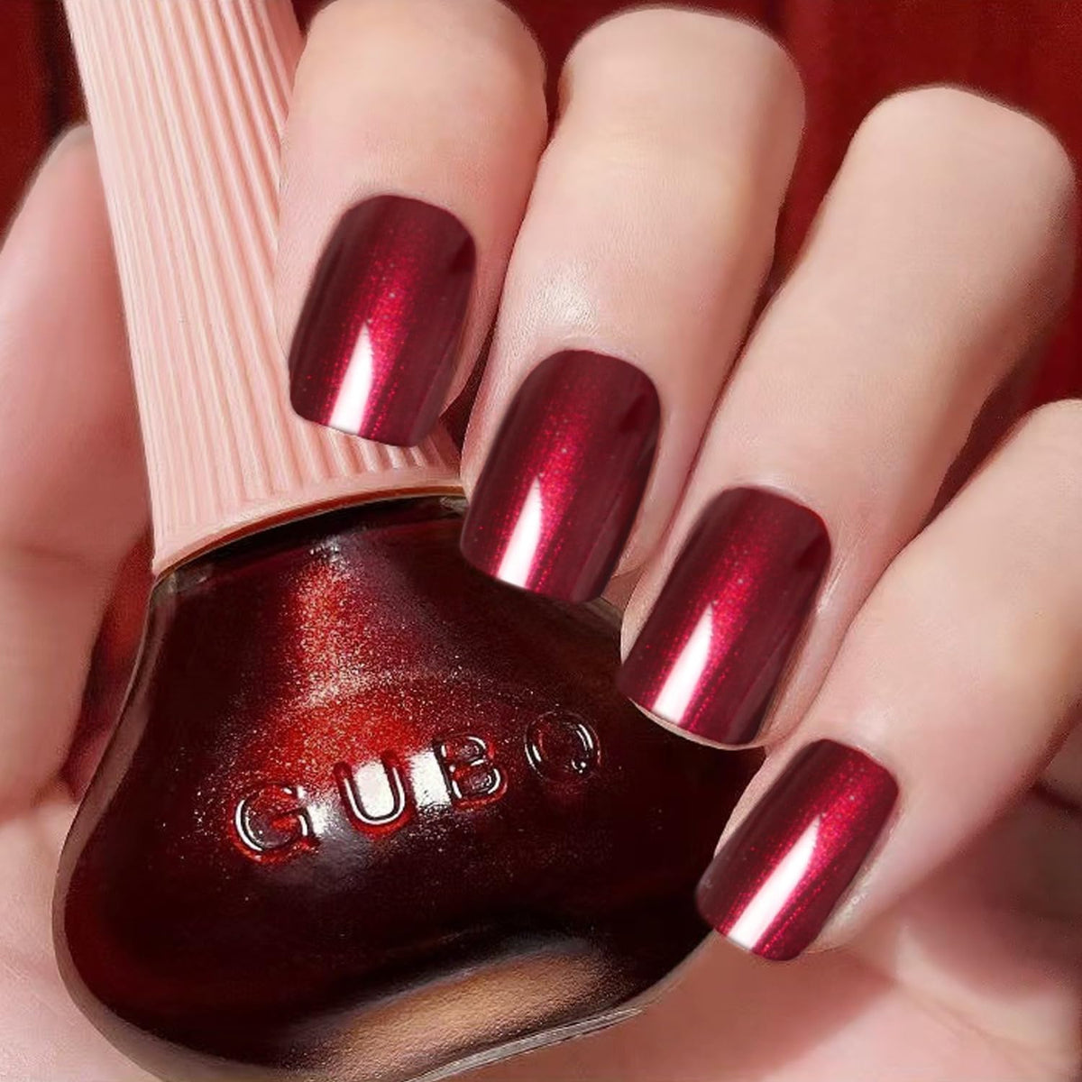 Major Dijit front bottle showing pearlescent wine red color and glossy finish benefit