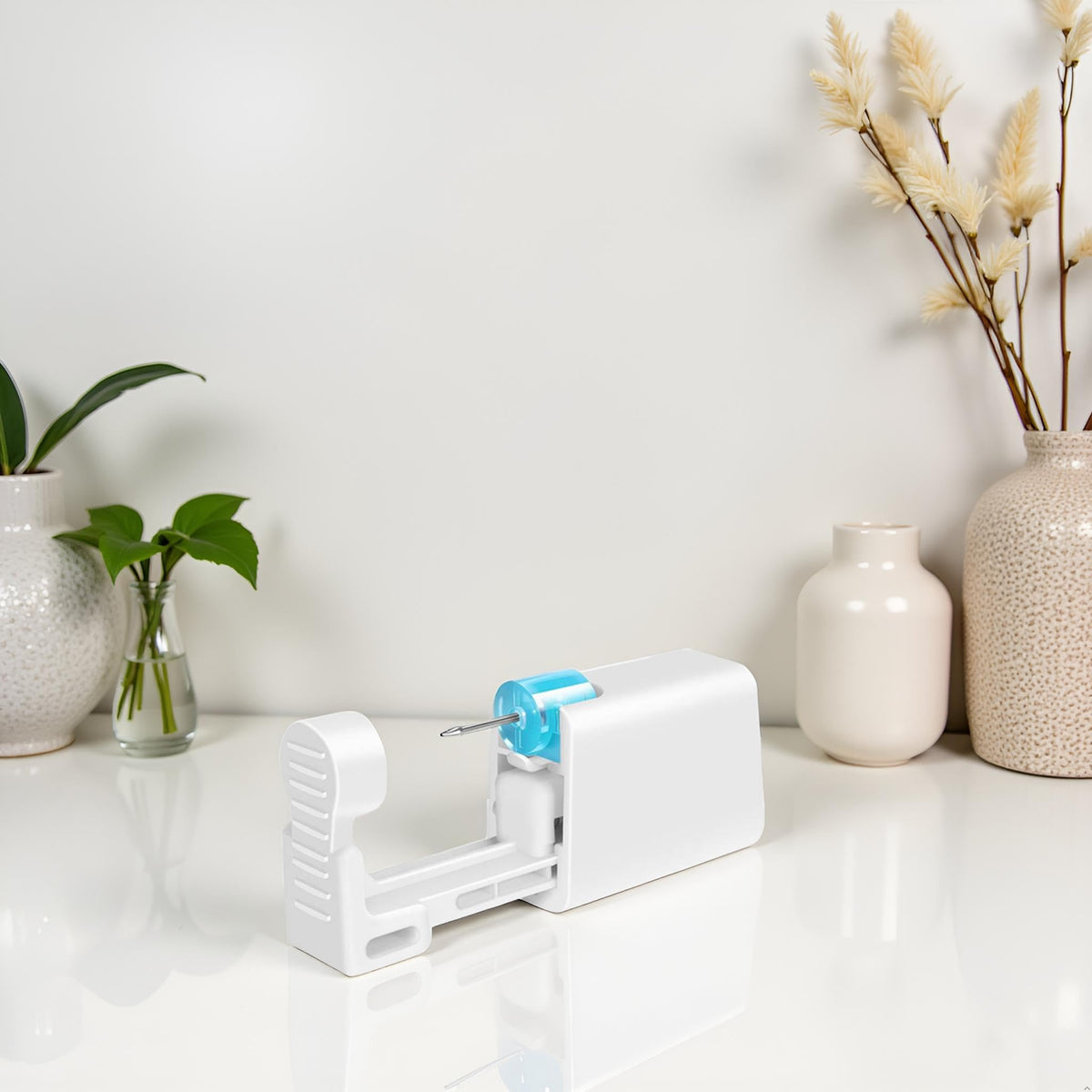 makalong kit beside a coin for size comparison to show portability and scale