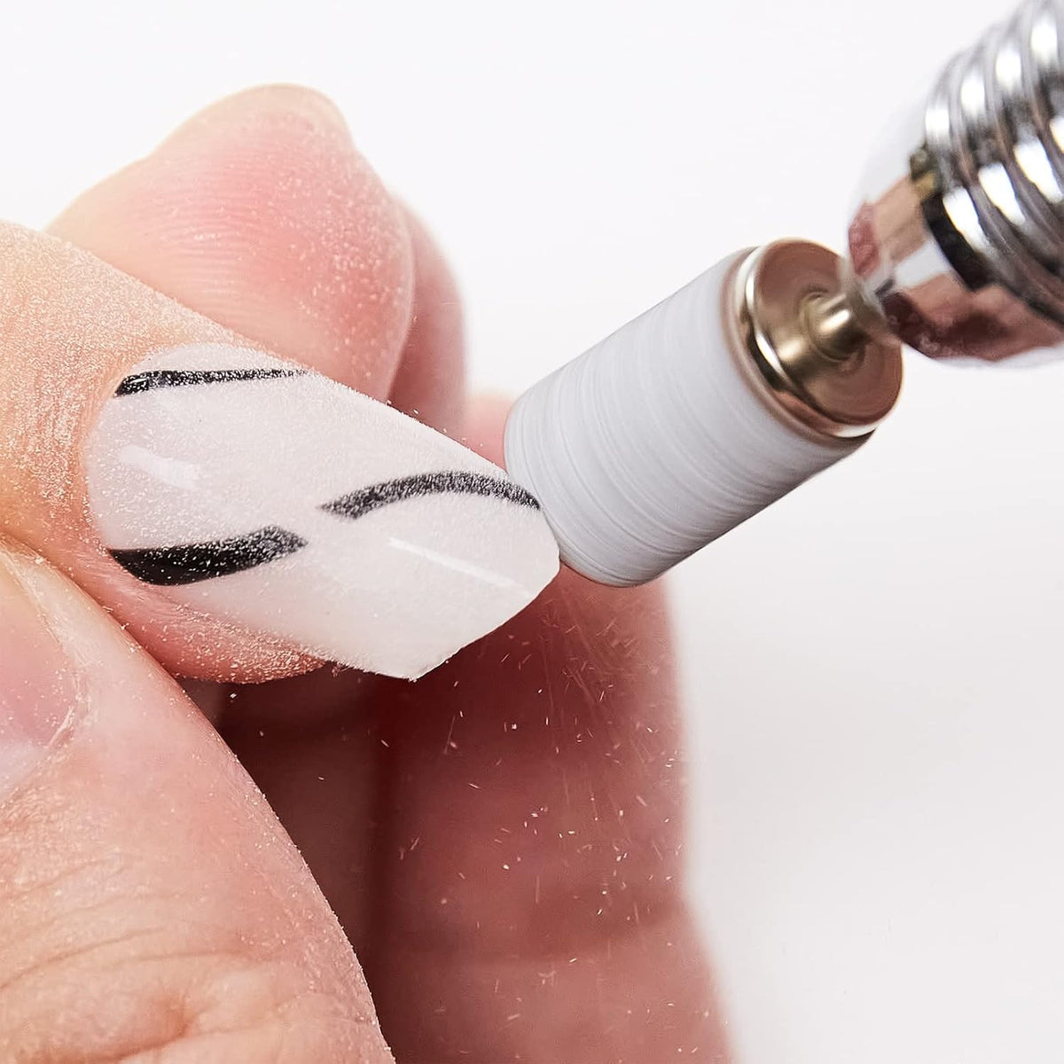 Makartt sanding band next to fingertip showing scale for precise use
