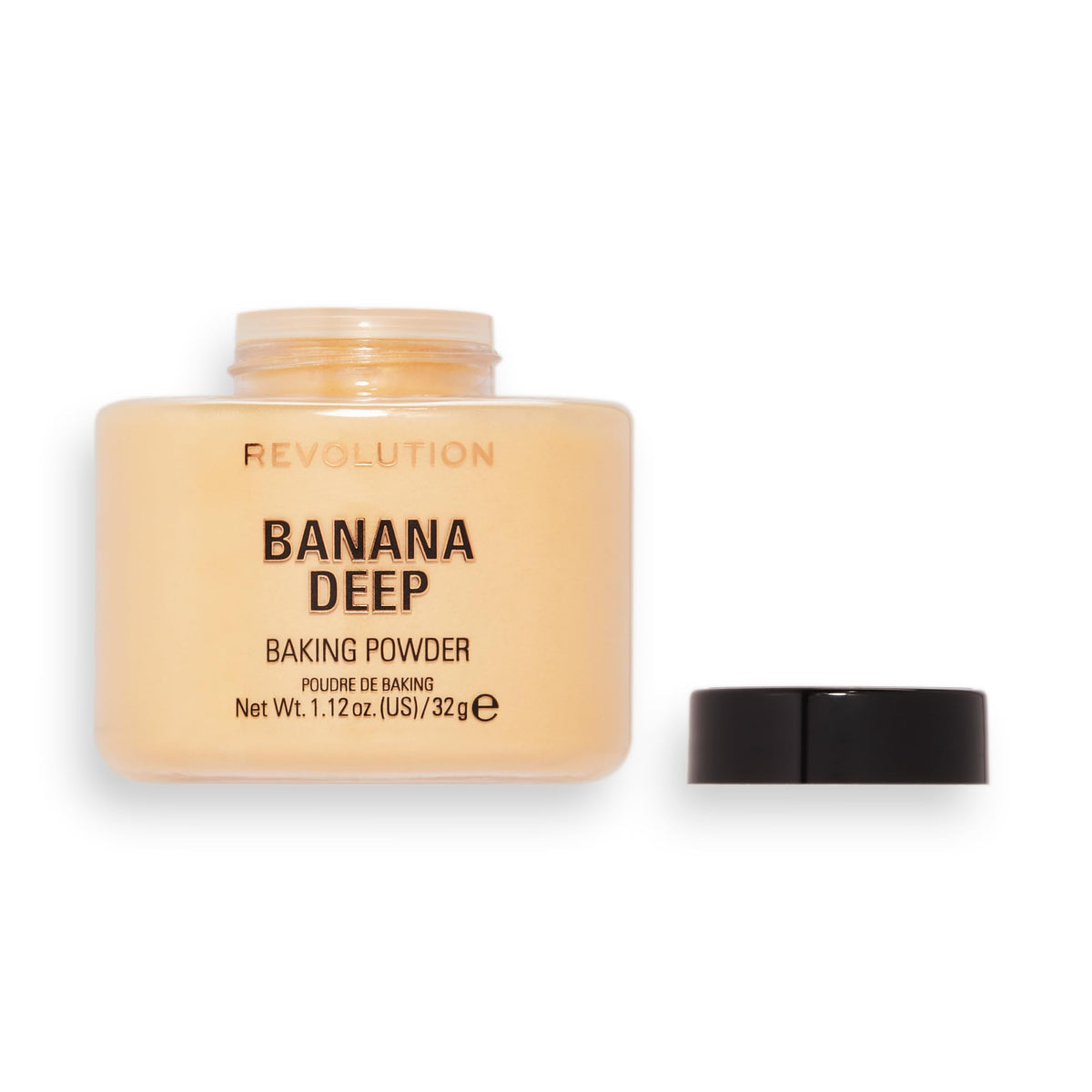 Makeup Revolution powder being patted with damp sponge to lock concealer