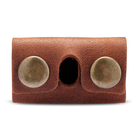 MAKYN button closure detail illustrating secure snap and reliable hold