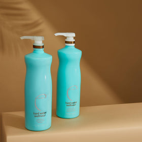 Malibu C duo sitting in shower illustrating practical in-shower use