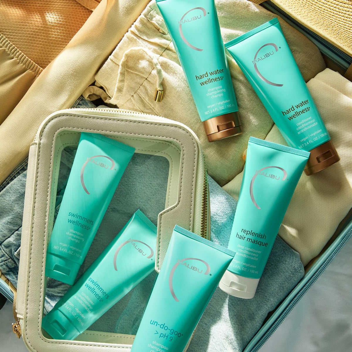 Malibu C travel bottle on bathroom shelf, lifestyle scene conveying salon-quality travel care