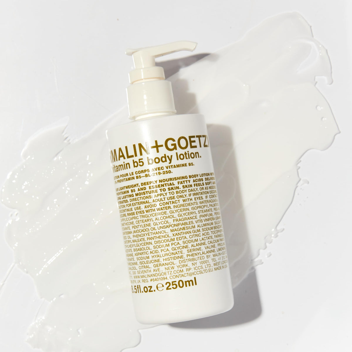 MALIN+GOETZ bottle in hand for scale, shows 7.5 fl oz portability benefit