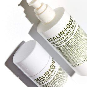 MALIN+GOETZ bottle styled on bathroom counter suggesting everyday luxury and convenience