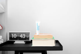 MALIN+GOETZ tube in hand showing travel size convenience and portability